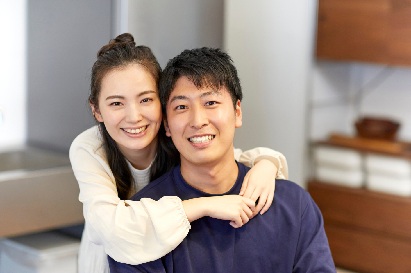 Happy Asian couple smiling with healthy teeth and gums
