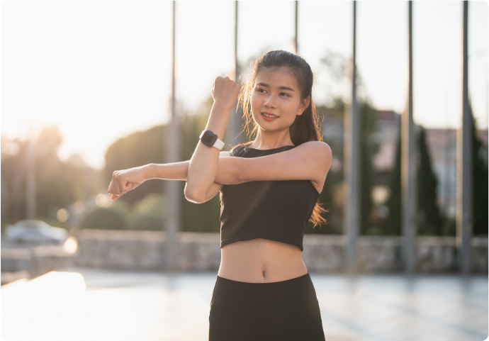 Asian woman stretching outdoors in activewear promoting overall health and wellness