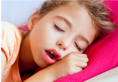 Young child sleeping with an open mouth, illustrating mouth breathing during sleep.